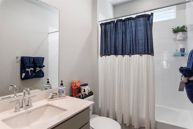 bathroom with vanity, toilet, and shower / bath combo with shower curtain