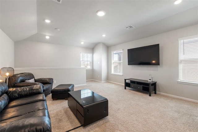 living room with recessed lighting, baseboards, light carpet, and visible vents