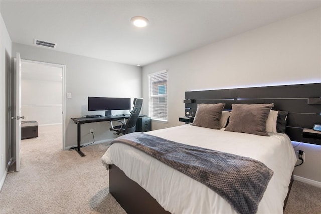 bedroom featuring visible vents, carpet floors, and baseboards