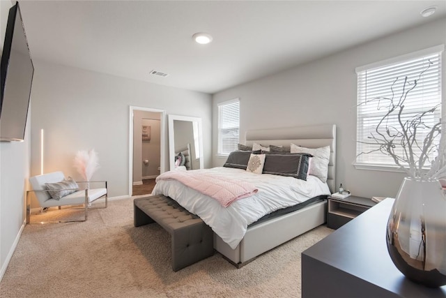 bedroom featuring visible vents, carpet floors, and baseboards