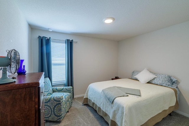 bedroom featuring baseboards and carpet floors