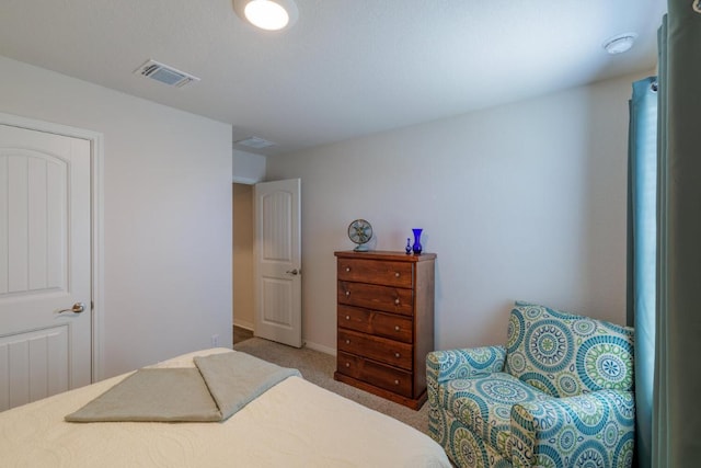 bedroom featuring carpet flooring and visible vents