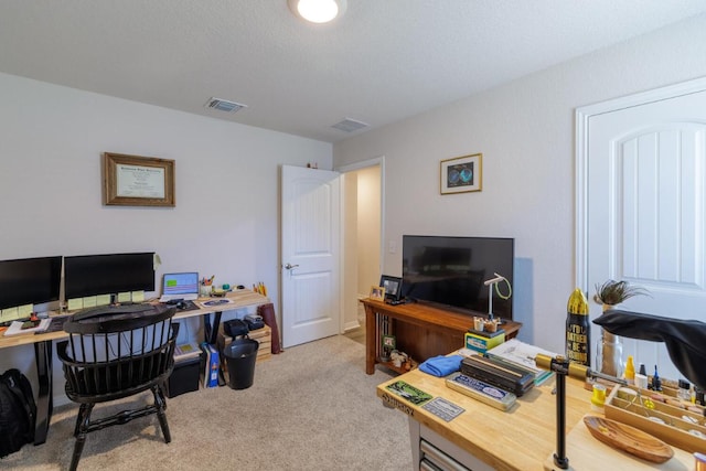 carpeted home office with visible vents