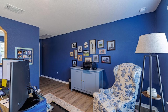 106 Pelican Ct, Bastrop, TX 78602 - living area featuring wood finished floors and baseboards