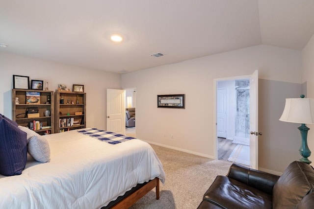 carpeted bedroom with baseboards and lofted ceiling