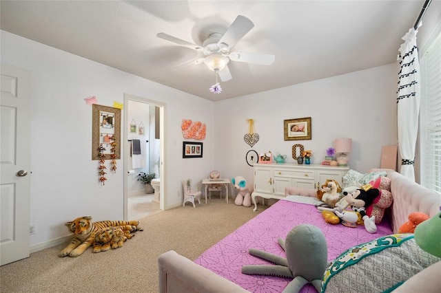 bedroom with connected bathroom, carpet floors, a ceiling fan, and baseboards