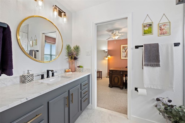 bathroom featuring marble finish floor, vanity, and a ceiling fan