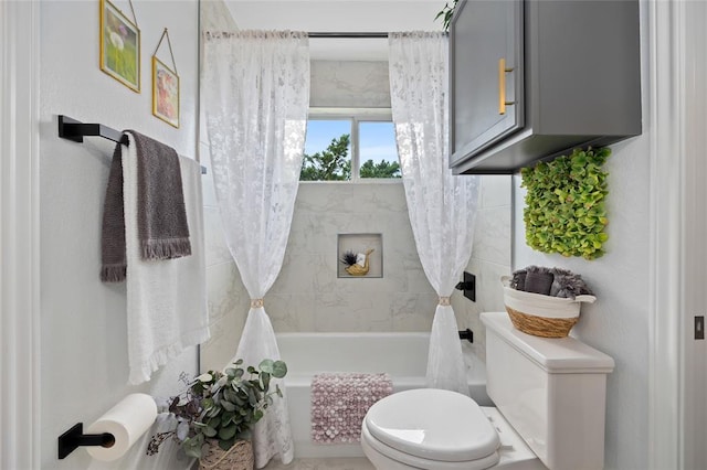full bathroom featuring shower / tub combo and toilet