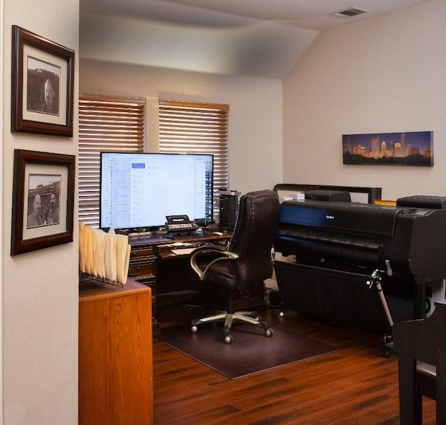 office area with visible vents, lofted ceiling, and wood finished floors