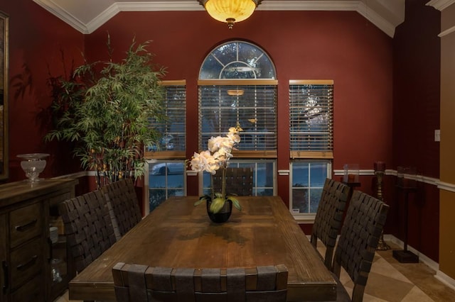 dining area featuring crown molding