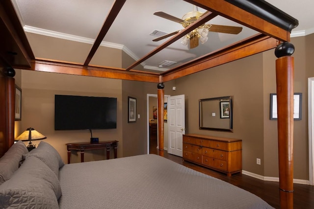 bedroom with visible vents, crown molding, baseboards, and wood finished floors