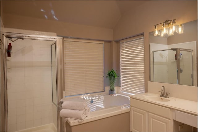 full bath with lofted ceiling, vanity, a bath, and a shower stall