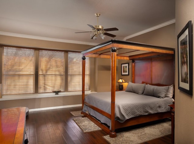 bedroom with crown molding, hardwood / wood-style flooring, and baseboards