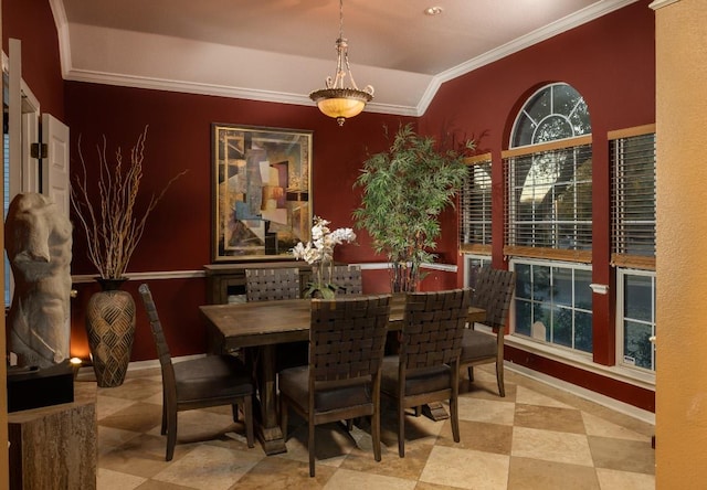 dining room featuring vaulted ceiling, baseboards, and ornamental molding