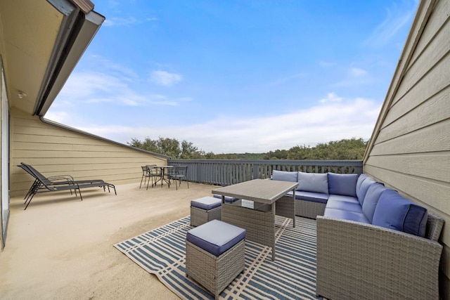 view of patio with outdoor lounge area and outdoor dining area