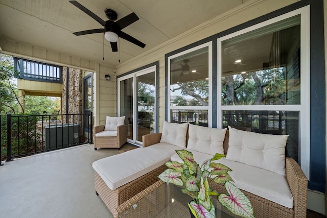 sunroom / solarium with a wealth of natural light and a ceiling fan