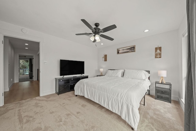 carpeted bedroom featuring recessed lighting, baseboards, and ceiling fan