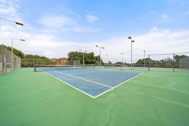 view of sport court with fence