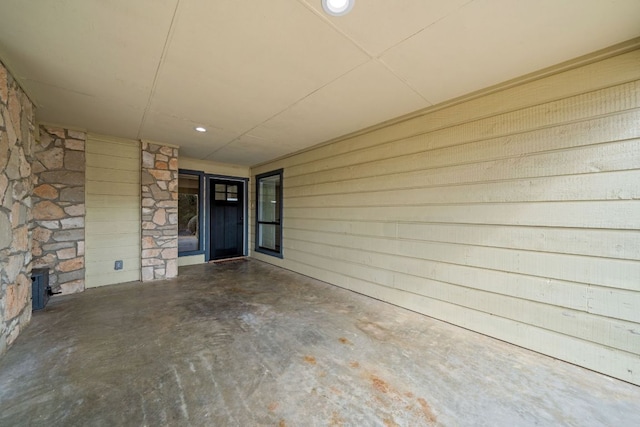 view of exterior entry with a carport