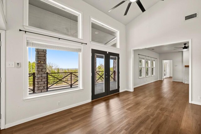 6607 Avenida Ann Dr, Lago Vista, TX 78645 - entrance foyer with ceiling fan, french doors, wood finished floors, high vaulted ceiling, and baseboards