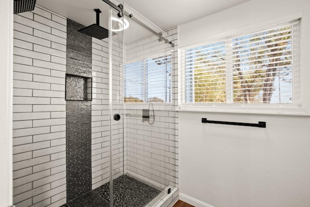 bathroom with a shower stall