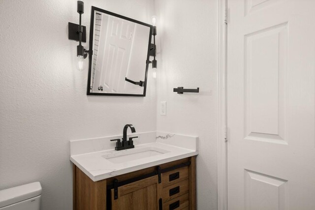 6607 Avenida Ann Dr, Lago Vista, TX 78645 - half bath with vanity and toilet