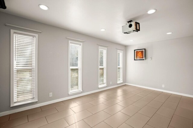 6607 Avenida Ann Dr, Lago Vista, TX 78645 - tiled spare room featuring baseboards and recessed lighting