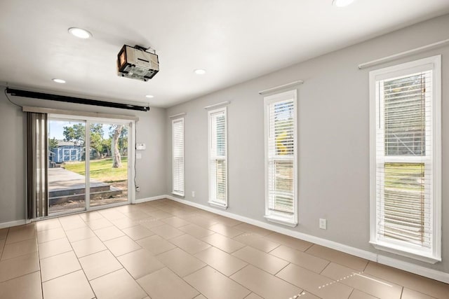6607 Avenida Ann Dr, Lago Vista, TX 78645 - empty room with plenty of natural light, baseboards, recessed lighting, and light tile patterned floors