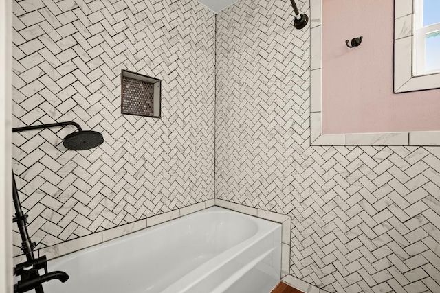 full bath featuring tile walls, walk in shower, and a washtub