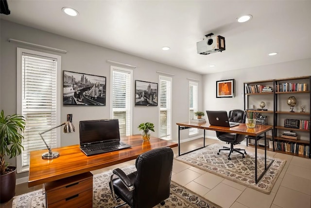 office featuring recessed lighting, plenty of natural light, and tile patterned flooring