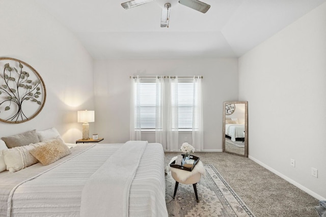 bedroom with lofted ceiling, carpet flooring, baseboards, and ceiling fan