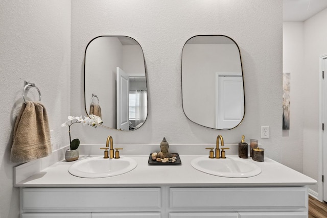 bathroom with double vanity and a sink