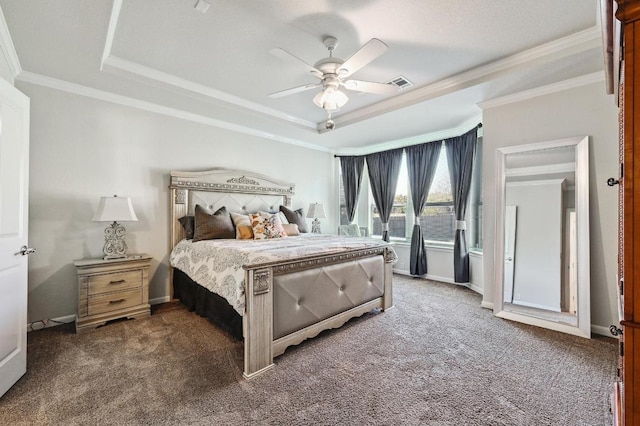 bedroom featuring visible vents, a raised ceiling, carpet, and baseboards