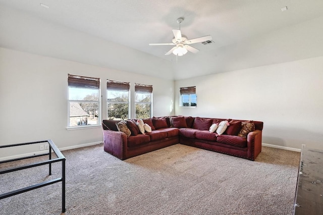 living room featuring visible vents, baseboards, ceiling fan, and carpet floors