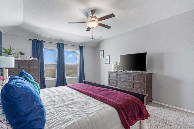 carpeted bedroom with baseboards, lofted ceiling, and ceiling fan