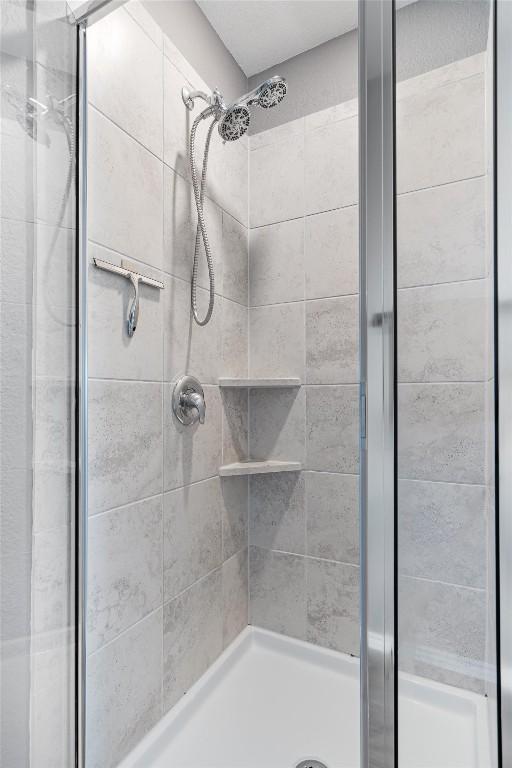 bathroom with a shower stall