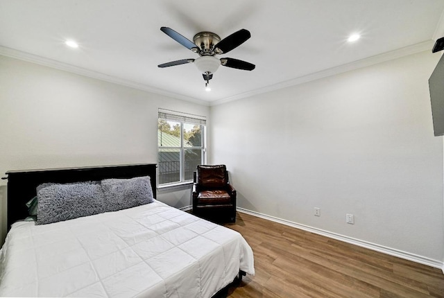 bedroom with ornamental molding, wood finished floors, recessed lighting, baseboards, and ceiling fan