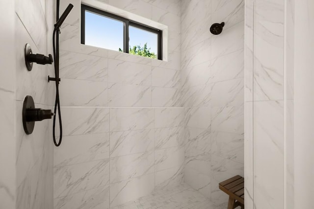 full bathroom with a tile shower