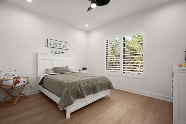 bedroom featuring recessed lighting, baseboards, ceiling fan, and light wood finished floors