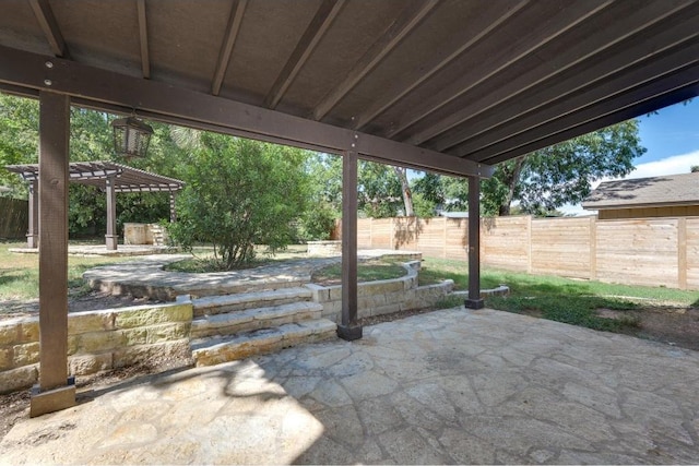 view of patio / terrace with fence and a pergola