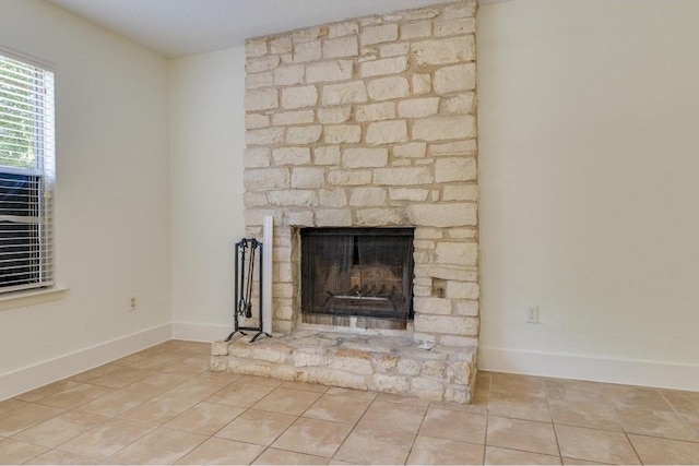 details featuring a fireplace and baseboards