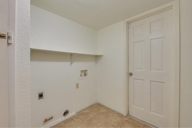 laundry area featuring electric dryer hookup, light tile patterned floors, gas dryer hookup, hookup for a washing machine, and laundry area