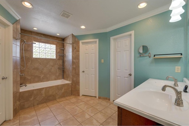 full bathroom with tile patterned flooring, visible vents, and a sink