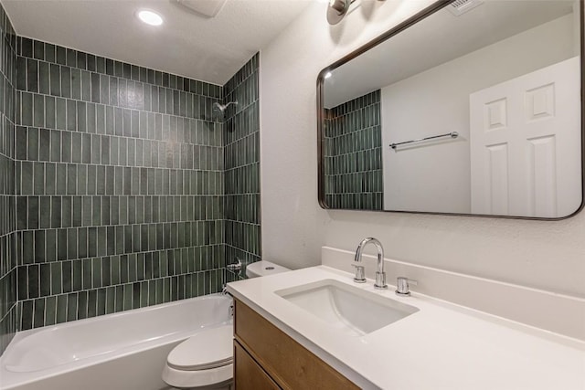 full bath featuring vanity, toilet, and washtub / shower combination