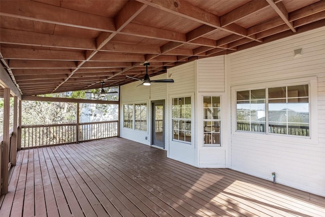 wooden deck featuring a ceiling fan