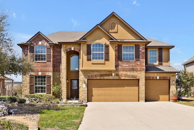 view of front facade featuring driveway, roof with shingles, an attached garage, stucco siding, and stone siding