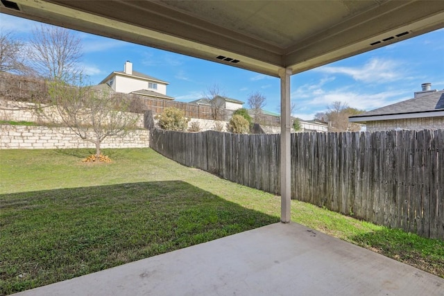 view of yard with a patio and a fenced backyard