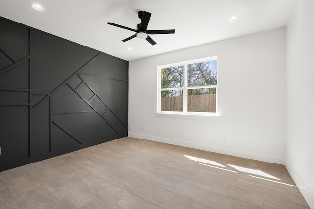 empty room with recessed lighting, baseboards, and a ceiling fan