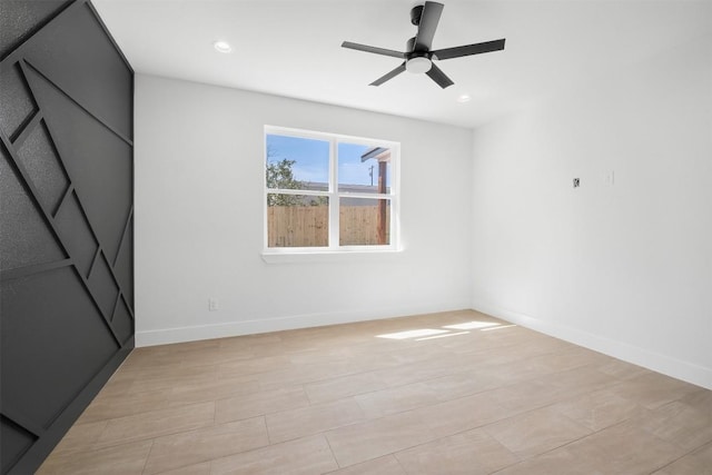 empty room featuring recessed lighting, baseboards, and a ceiling fan