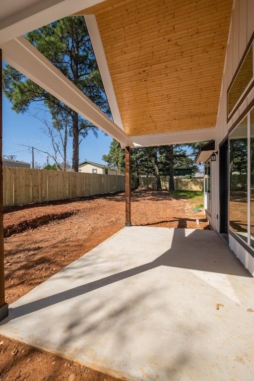 view of patio / terrace featuring fence